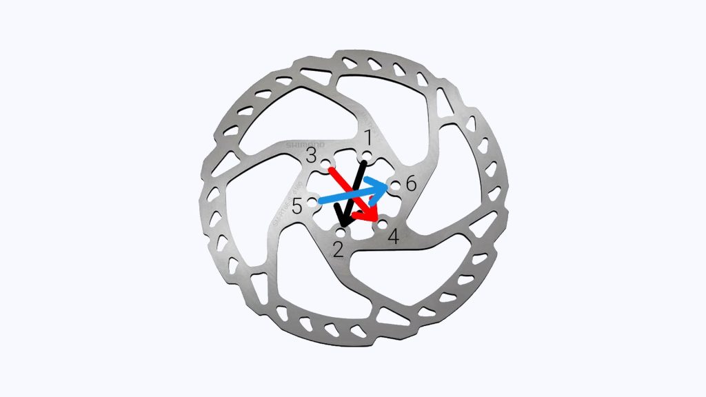 undoing bolts on bike rotor in cross pattern