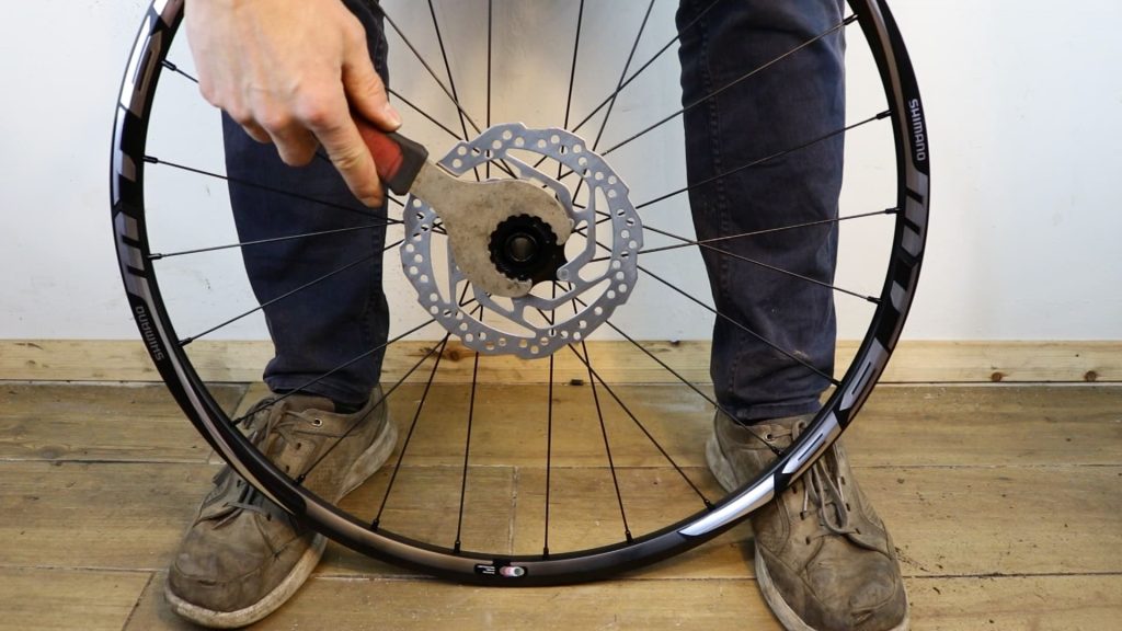 removal tool placed over the bike rotor's lock ring