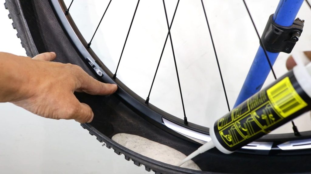 purring sealant to a deflated tyre