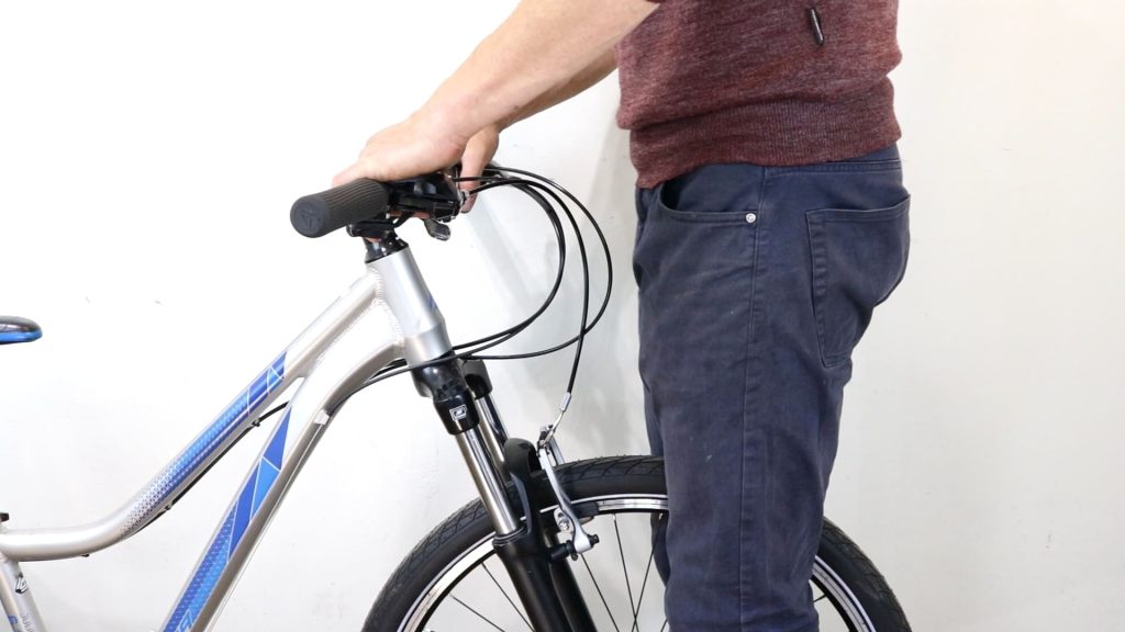 standing in front of a bike