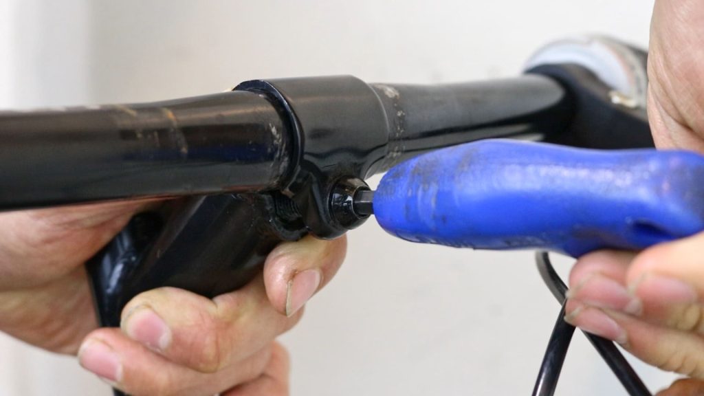 tightening handlebars to the quill stem