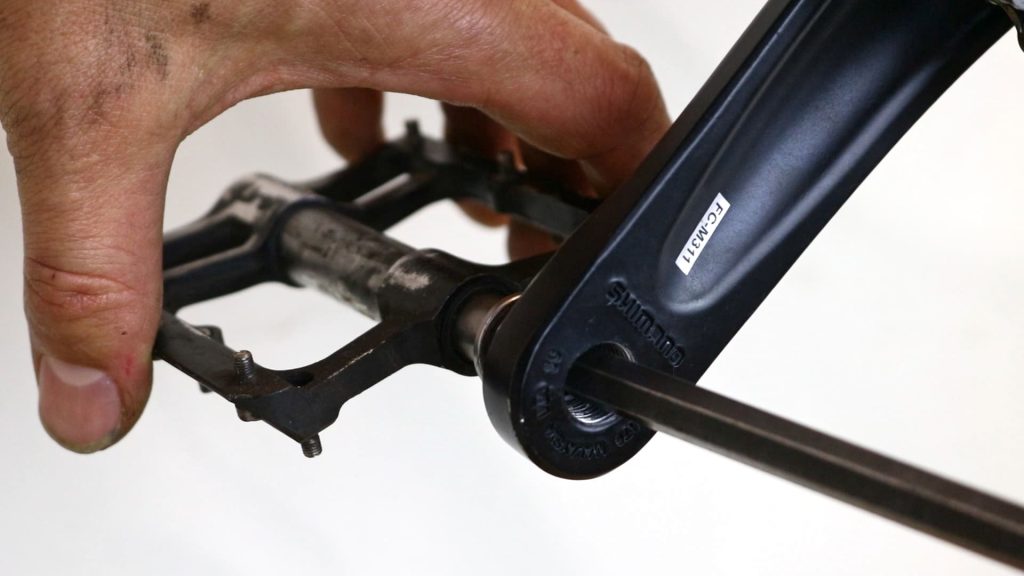 unscrewing bike pedals with allen key