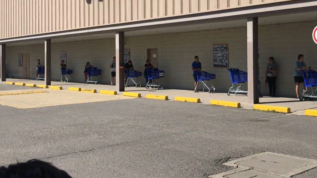 brexit and covid 19 people queing at the shop