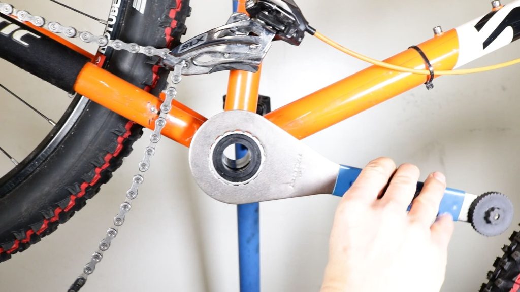 tightening an external bottom bracket with a tool