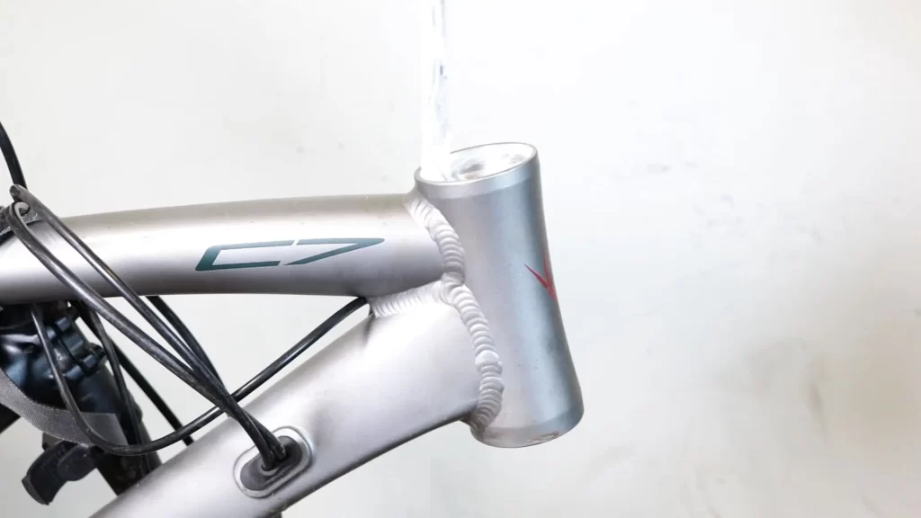 Greasing inside the head tube where bearing cups sit