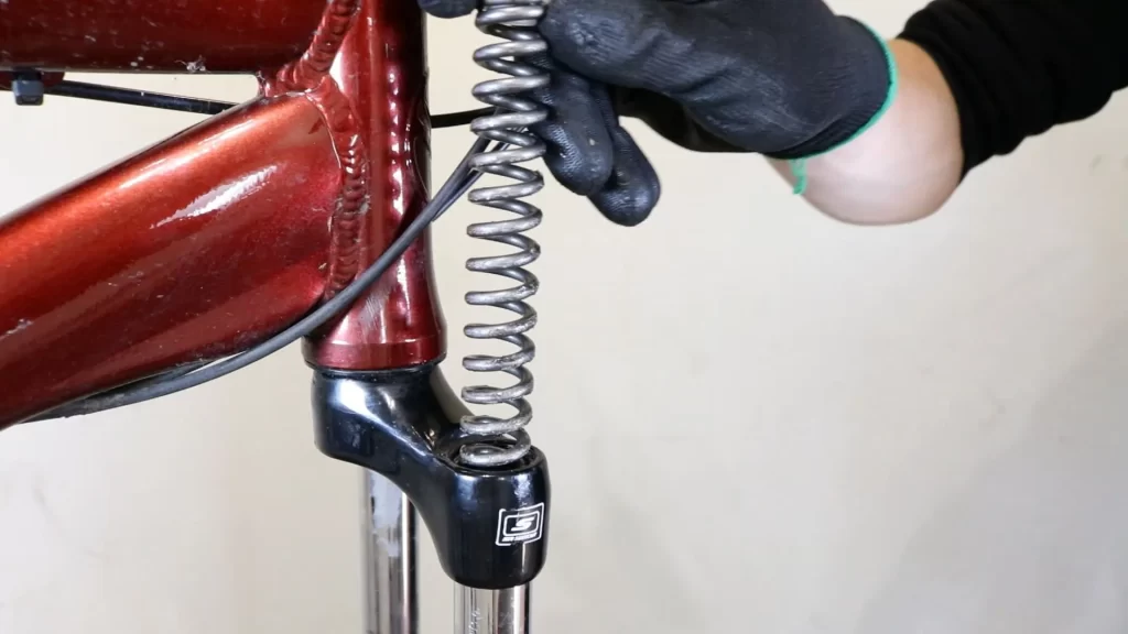 remove the coil spring from suntour forks