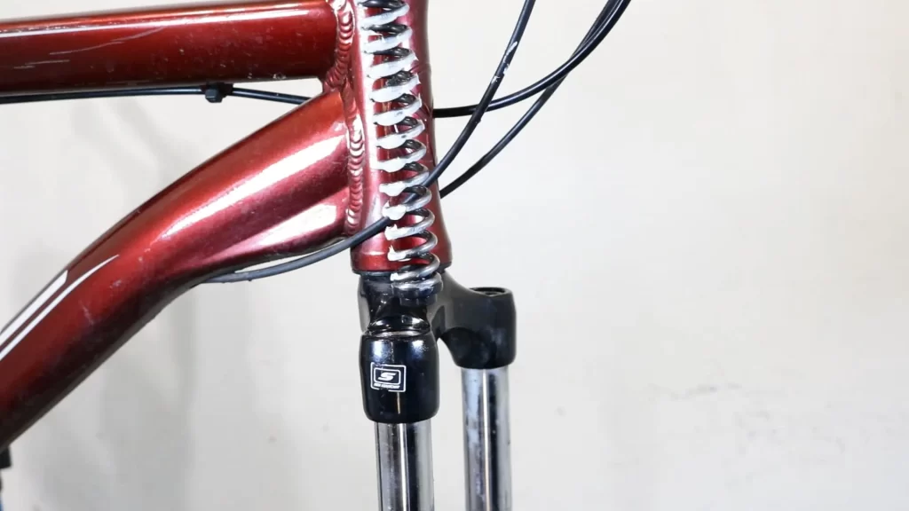 refit the coil spring into suntour forks