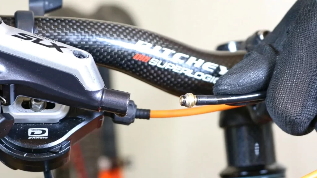 removing the hose from the lever for shortening Shimano brake hose